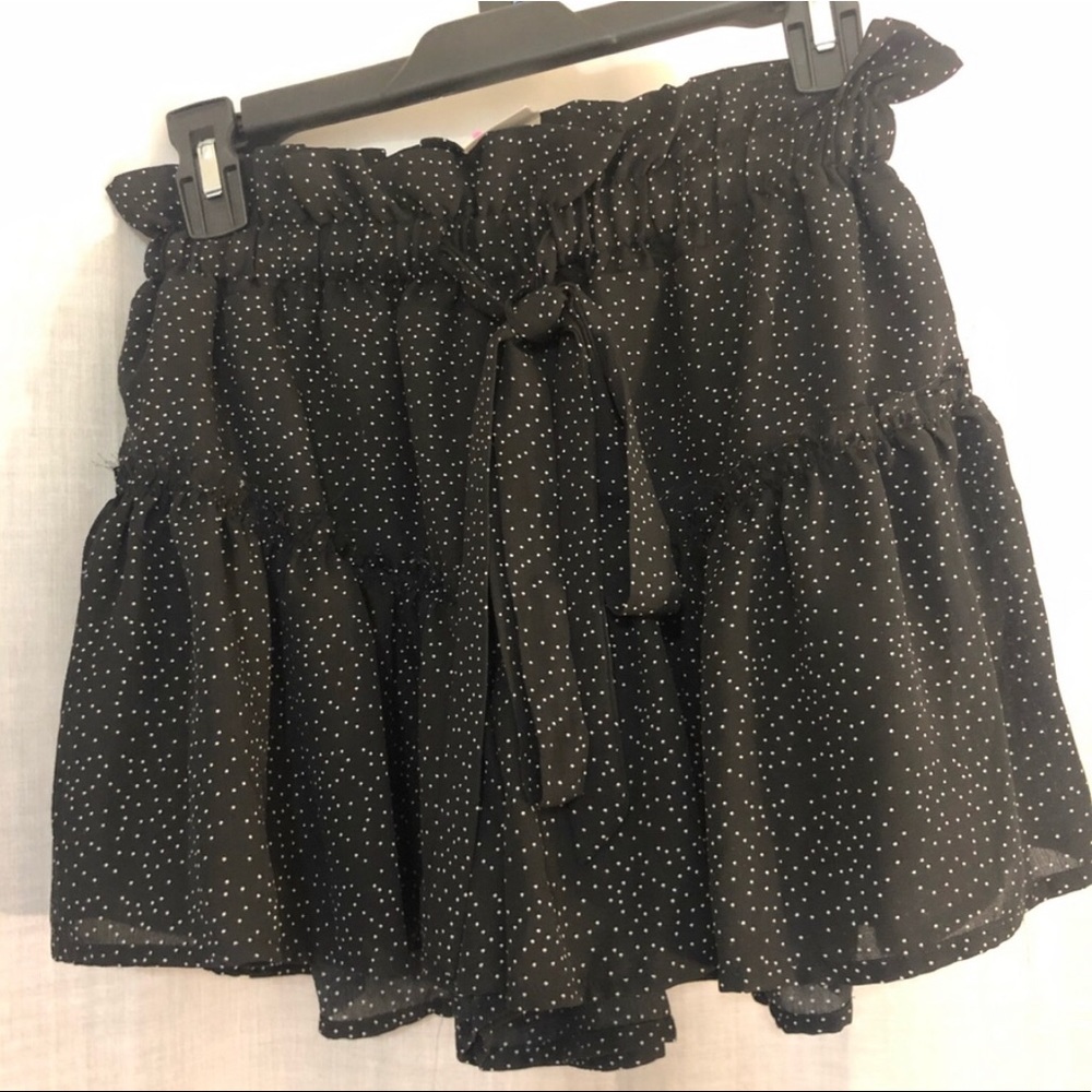 Black shorts with white polka dots